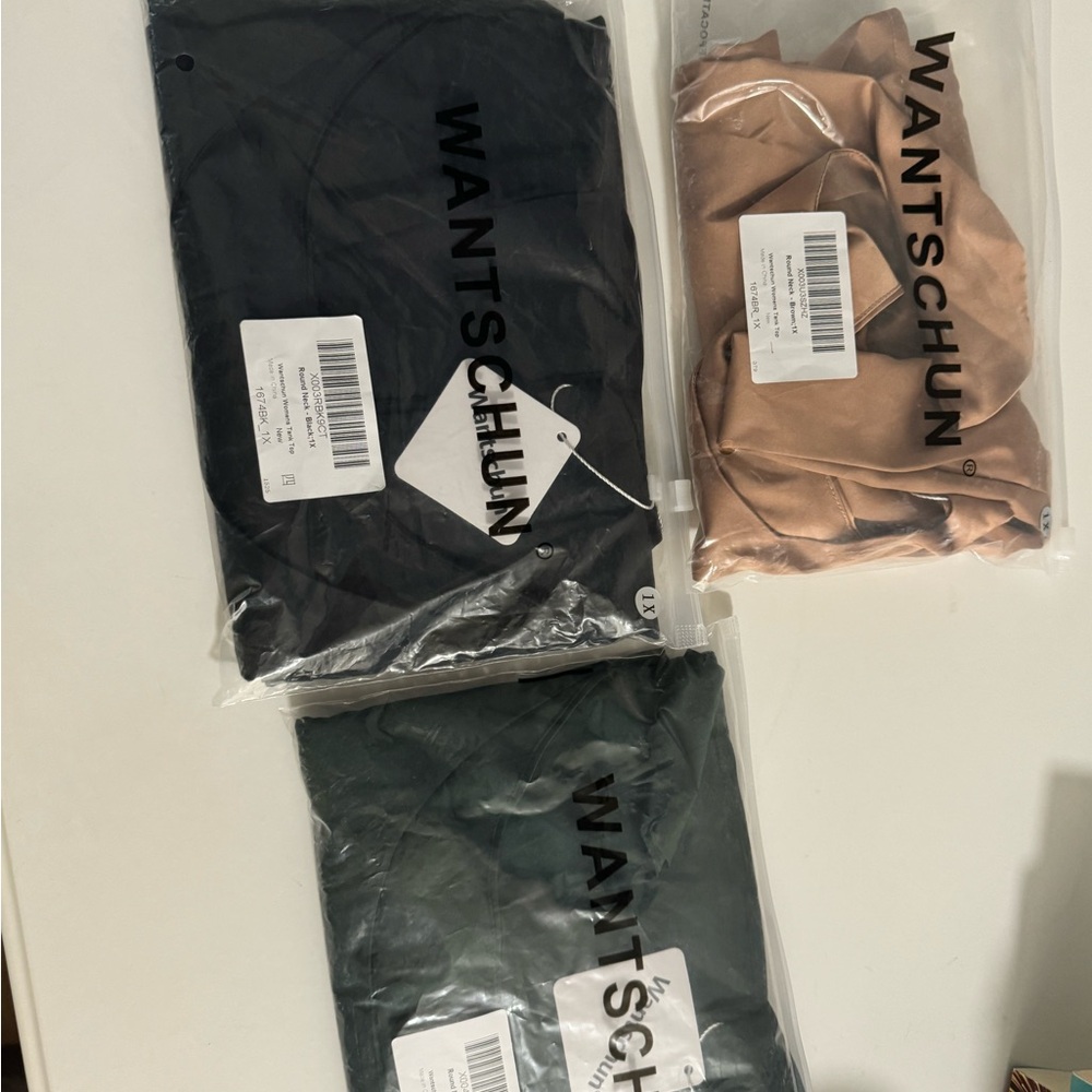 3 tops. Green, black, tan